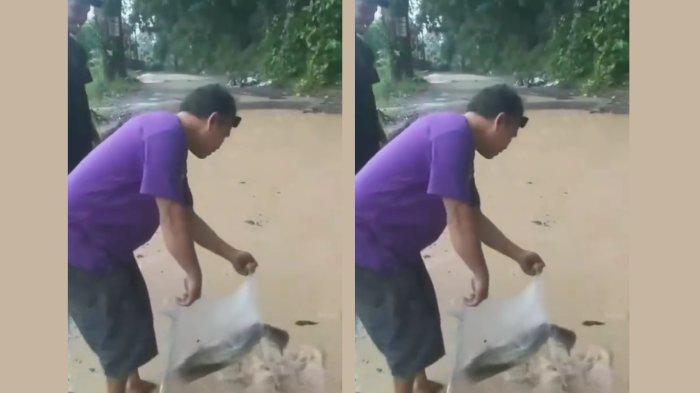 viral-video-pria-sindir-pejabat-dengan-taruh-ikan-di-jalan-rusak